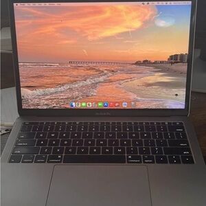 Apple Silver MacBook Laptop with Slim Design and Backlit Keyboard